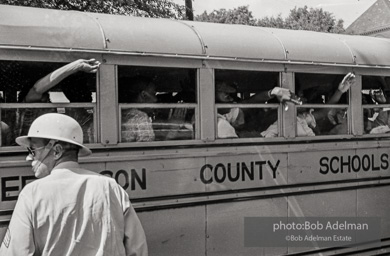 A bus full of youthful protestors heading for a detention center. Birmingham, AL, 1963.