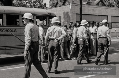 Arrested protestors are loaded onto a bus and taken to a detention center. Birmingham, AL, 1963.