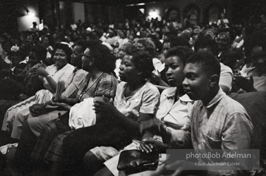 The audience responds as Martin Luther King and Ralph Abernathy speak at the 16th Stret Baptist Church. Birmingham Alabama, 1963.