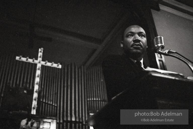 During a mass meeting at the 16th Street Baptist Church, King urges his supporters to join the demonstrations,  Birmingham,  Alabama.  1963