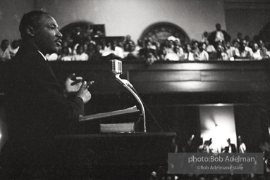 During a mass meeting at the 16th Street Baptist Church, King urges his supporters to join the demonstrations,  Birmingham,  Alabama.  1963