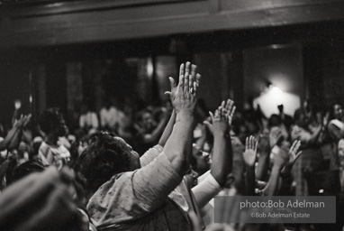 The audience responds as Martin Luther King and Ralph Abernathy speak at the 16th Stret Baptist Church. Birmingham Alabama, 1963.