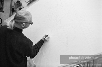 Roy Lichtenstein, while working on his painting Interior with Woman Leaving. 1996.-photo©Bob Adelman, artwork ©Estate of Roy Lichtenstein