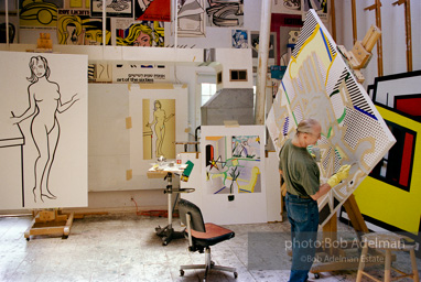 Roy Lichtenstein working on his painting Interior with Painting of Bather.1997-photo©Bob Adelman, artwork ©Estate of Roy Lichtenstein