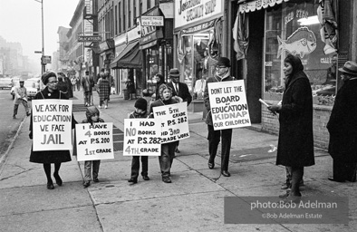 The Bibulb family march in the neighborhood of Bedford-Stuyvesant to protest unfair treatment and for more and better resources for schools.-Brooklyn chapter of the Congress of Racial Equality marches and  sit-in at P.S. 200. November, 1962.