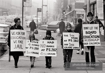 The Bibulb family march in the neighborhood of Bedford-Stuyvesant to protest unfair treatment and for more and better resources for schools.-Brooklyn chapter of the Congress of Racial Equality marches and  sit-in at P.S. 200. November, 1962.