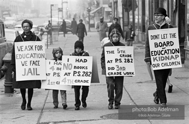 The Bibulb family march in the neighborhood of Bedford-Stuyvesant to protest unfair treatment and for more and better resources for schools.-Brooklyn chapter of the Congress of Racial Equality marches and  sit-in at P.S. 200. November, 1962.