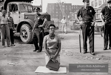 Determined to end unfair hiring practices, protestors put their lives on the line, closing down a construction site at the Downstate Medical Center. Brooklyn, New York City, July, 1963.