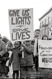 We shall not be moved. Safety first: Parents and children respond to a wave of accidents by blocking their street and demanding the installation of a traffic light,  Brooklyn,  New York City. January 17, 1963.