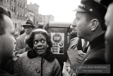 We shall not be moved. Safety first: Parents and children respond to a wave of accidents by blocking their street and demanding the installation of a traffic light,  Brooklyn,  New York City. January 17, 1963.