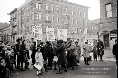 We shall not be moved. Safety first: Parents and children respond to a wave of accidents by blocking their street and demanding the installation of a traffic light,  Brooklyn,  New York City. January 17, 1963.