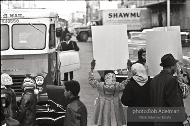 We shall not be moved. Safety first: Parents and children respond to a wave of accidents by blocking their street and demanding the installation of a traffic light,  Brooklyn,  New York City. January 17, 1963.