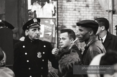 We shall not be moved. Safety first: Parents and children respond to a wave of accidents by blocking their street and demanding the installation of a traffic light,  Brooklyn,  New York City. January 17, 1963.