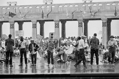 Singing in the rain,  Atlantic City, New Jersey. 1964

“Just back from the horrific and heroic Freedom Summer campaign of 1964, where they were attempting to register black voters in the Deep South, students sang and protested outside the Democratic Party National Convention in Atlantic City. They were asking for color-blind voting laws for delegates and voters alike.”