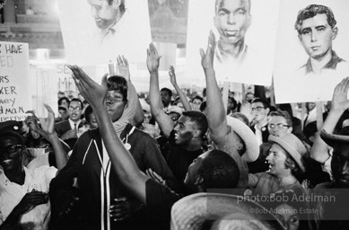 Nighttime demonstration in support of the Mississippi Freedom Democratic Party, with images of slain civil rights workers Schwerner, Chaney and Goodman, Atlantic City, NJ 1964