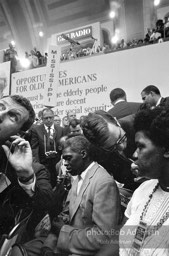 Reporters flock to the Mississippi delegation on the floor of the convention center where members of the Mississippi Freedom Party wish to join an be recognized.Democratic National Convention. Atlantic City,1964.