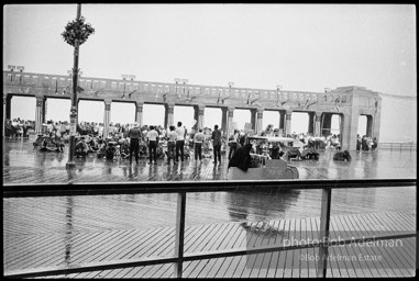 Singing in the rain,  Atlantic City, New Jersey. 1964

“Just back from the horrific and heroic Freedom Summer campaign of 1964, where they were attempting to register black voters in the Deep South, students sang and protested outside the Democratic Party National Convention in Atlantic City. They were asking for color-blind voting laws for delegates and voters alike.”