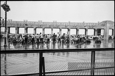 Singing in the rain,  Atlantic City, New Jersey. 1964

“Just back from the horrific and heroic Freedom Summer campaign of 1964, where they were attempting to register black voters in the Deep South, students sang and protested outside the Democratic Party National Convention in Atlantic City. They were asking for color-blind voting laws for delegates and voters alike.”