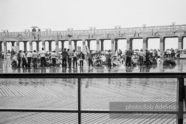 Singing in the rain,  Atlantic City, New Jersey. 1964

“Just back from the horrific and heroic Freedom Summer campaign of 1964, where they were attempting to register black voters in the Deep South, students sang and protested outside the Democratic Party National Convention in Atlantic City. They were asking for color-blind voting laws for delegates and voters alike.”