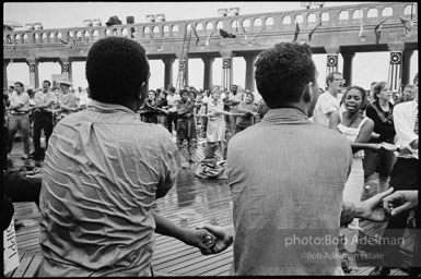 Singing in the rain,  Atlantic City, New Jersey. 1964

“Just back from the horrific and heroic Freedom Summer campaign of 1964, where they were attempting to register black voters in the Deep South, students sang and protested outside the Democratic Party National Convention in Atlantic City. They were asking for color-blind voting laws for delegates and voters alike.”