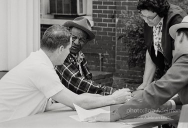 A new voter casting ballot orally under Federal observation. Camden, 1966. photo:©Bob Adelman, from the book DOWN HOME by Bob Adelman and Susan Hall.