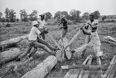 Splitting logs on the Tait Plantation. Opossum Bend, 1965. photo:©Bob Adelman, from the book DOWN HOME by Bob Adelman and Susan Hall.