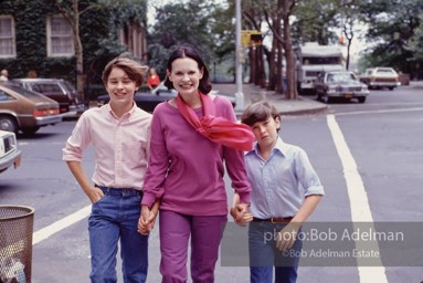 Gloria Vanderbilt walks on the upper east side between her two sons, Carter Vanderbilt Cooper  and Anderson Cooper. New York City, 1980.