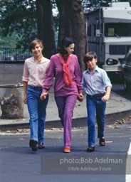 Gloria Vanderbilt walks on the upper east side between her two sons, Carter Vanderbilt Cooper  and Anderson Cooper. New York City, 1980.