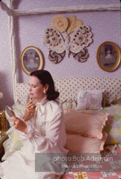 Gloria Vanderbilt brushes her hair in the boudoir of her New York City apartment, 1980.