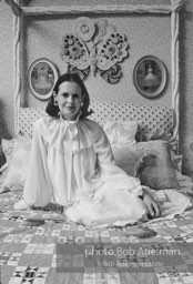 Gloria Vanderbilt poses in a peignoir with a hair brush not disimilar to the one featured in her new erotic novel. New York City, 1980.