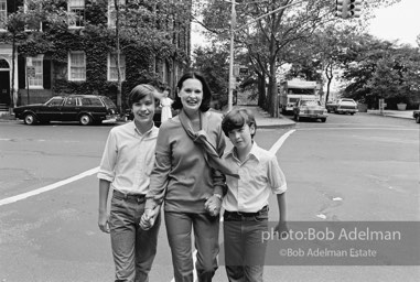 Gloria Vanderbilt walks on the upper east side between her two sons, Carter Vanderbilt Cooper and Anderson Cooper. New York City, 1980.