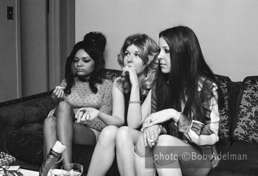 Silky, high on cocaine, smokes marijuana as Cindy, Lois and Linda watch. - New York City, 1970. photo:©Bob Adelman. From the book Gentleman of Leisure by Susan Hall and Bob Adelman.