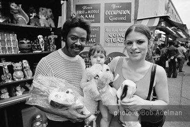 Silky, Betsy and Kitty at a game stand. - New York City, 1970. photo:©Bob Adelman. From the book Gentleman of Leisure by Susan Hall and Bob Adelman.