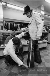 Silky is fitted for $900 worht of suits. New York City, 1970. photo:©Bob Adelman. From the book Gentleman of Leisure by Susan Hall and Bob Adelman.