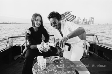 Linda and Silky drink champagne on George's boat. - New York City, 1970. photo:©Bob Adelman. From the book Gentleman of Leisure by Susan Hall and Bob Adelman.