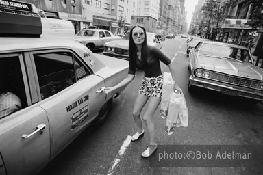 Linda leaves Silky and buys a pair of pants and shoes. She then return to a motel. - New York City, 1970. photo:©Bob Adelman. From the book Gentleman of Leisure by Susan Hall and Bob Adelman.