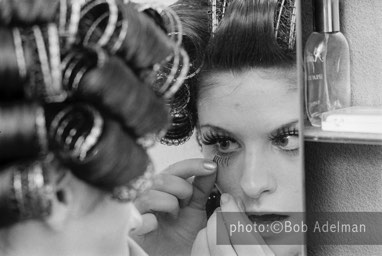 Kitty puts on her eyelashes before going to work. - New York City, 1970. photo:©Bob Adelman. From the book Gentleman of Leisure by Susan Hall and Bob Adelman.