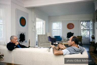 Adolph Gottlieb with collector Ben Heller at the Gottlieb's home in East Hampton, NY, 1964.  They are sitting in front of the paintings (left to right) Red and Green (1961) and Roman Two (1961). photo:©Bob Adelman/Artwork:©Adolph and Esther Gottlieb Foundation