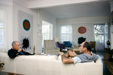 Adolph Gottlieb with collector Ben Heller at the Gottlieb's home in East Hampton, NY, 1964.  They are sitting in front of the paintings (left to right) Red and Green (1961) and Roman Two (1961). photo:©Bob Adelman/Artwork:©Adolph and Esther Gottlieb Foundation