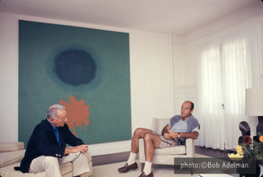 Adolph Gottlieb with collector Ben Heller at Gottlieb's home in East Hampton, NY, 1964.  They are sitting in front of Petaloid #2 (1963)-photo:©Bob Adelman/Artwork:©Adolph and Esther Gottlieb Foundation