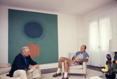 Adolph Gottlieb with collector Ben Heller at Gottlieb's home in East Hampton, NY, 1964.  They are sitting in front of Petaloid #2 (1963)-photo:©Bob Adelman/Artwork:©Adolph and Esther Gottlieb Foundation