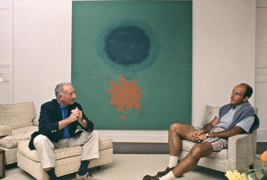 Adolph Gottlieb with collector Ben Heller at Gottlieb's home in East Hampton, NY, 1964.  They are sitting in front of Petaloid #2 (1963)-photo:©Bob Adelman/Artwork:©Adolph and Esther Gottlieb Foundation