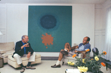 Adolph Gottlieb with collector Ben Heller at Gottlieb's home in East Hampton, NY, 1964.  They are sitting in front of Petaloid #2 (1963)-photo:©Bob Adelman/Artwork:©Adolph and Esther Gottlieb Foundation