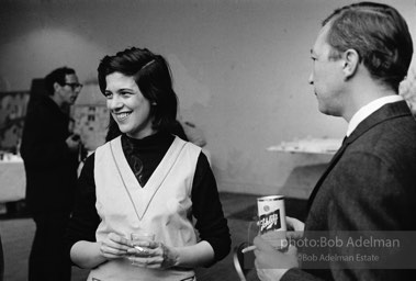 Susan Sontag and Jasper Johns at a party at Robert Rauschenberg's studio/loft. New York City, 1966.