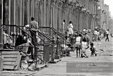 The Bedford Stuyvesant ghetto,  Brooklyn,  New York City.  1963

As difficult as the Bed Stuy street might look, it was
teeming with life. Twenty years later, I went back and
the neighborhood had fallen apart. All the buildings were
boarded up and deserted.