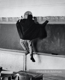 Kime Holman cutting up as Batman in class, Harlem, New York City.  1966