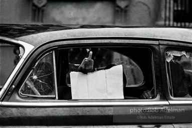 A salute, Brooklyn, New York City.  1963


“When these pictures were taken in the ’60s, racial tensions were mounting, and the Civil Rights Movement was front page news on a daily basis. The boy in the car was up to some mischief he didn’t want me seeing, and this was his response. My street sense told me he was saying, ‘White man, bad enough you put me down. Don’t stare.’”