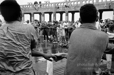 Singing in the rain,  Atlantic City, New Jersey. 1964

“Just back from the horrific and heroic Freedom Summer campaign of 1964, where they were attempting to register black voters in the Deep South, students sang and protested outside the Democratic Party National Convention in Atlantic City. They were asking for color-blind voting laws for delegates and voters alike.”