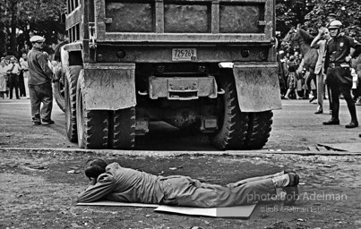 Stop action: Determined to end unfair hiring practices, two protestors put their lives on the line, closing down a construction site at the Downstate Medical Center, Brooklyn, New York City.  1963