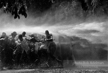 No man is an island,  Kelly Ingram Park,  Birmingham, Alabama.  1963


The police and firemen used a brute show of force to try to stop the ongoing demonstrations. It didnÕt work on this day. Rather than fleeing, the protestors hung on to each other and were able to stand up to the full fury of
the water, though not without casualties. I have never witnessed such cruelty. There was almost as much moisture behind the lens as in front. I gave a print of this picture to Dr. King. He studied it and said, ÔI am startled that out of so much pain some beauty came.